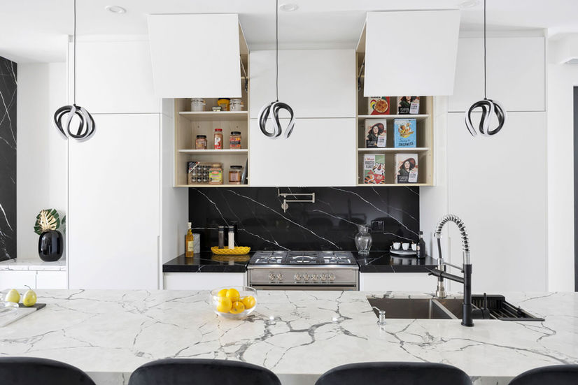 Luxury kitchen with quartz countertops and backsplash in Etobicoke custom home