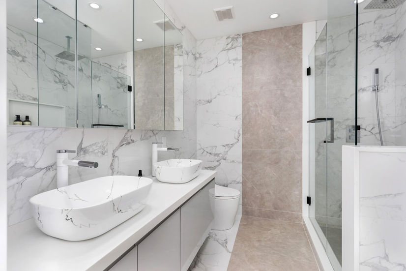 Bathroom with double vanity and glass shower in Etobicoke custom home