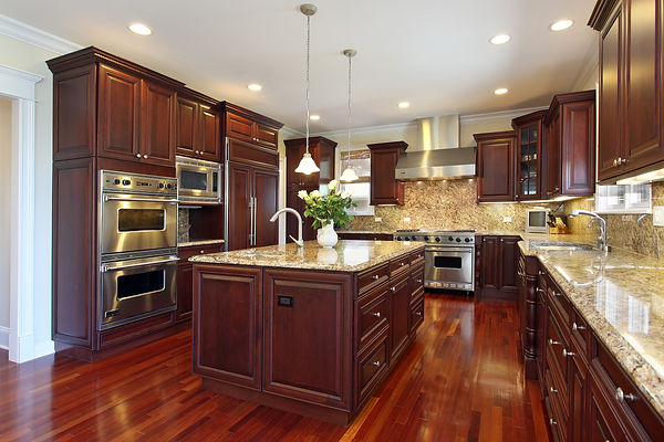 Traditional Kitchen with Dark Mahogany Cabinets, Stainless Steel Appliances, and Beige & Black Mottled Granite