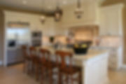 Off White French Country Kitchen, Stately Rustic Cabinets, Iron Light Fixtures, Cabinet Encased Range Hood, Extra Wide Fridge