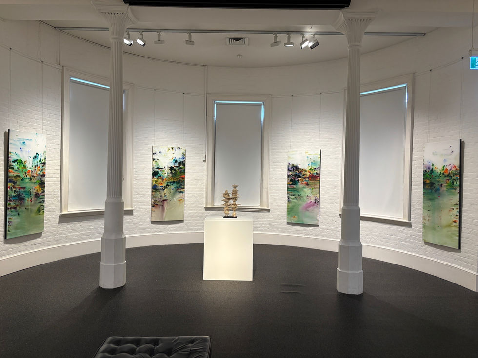 Artworks hanging on the wall of an art gallery.