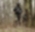 man holding rifle near the tre_edited.jpg