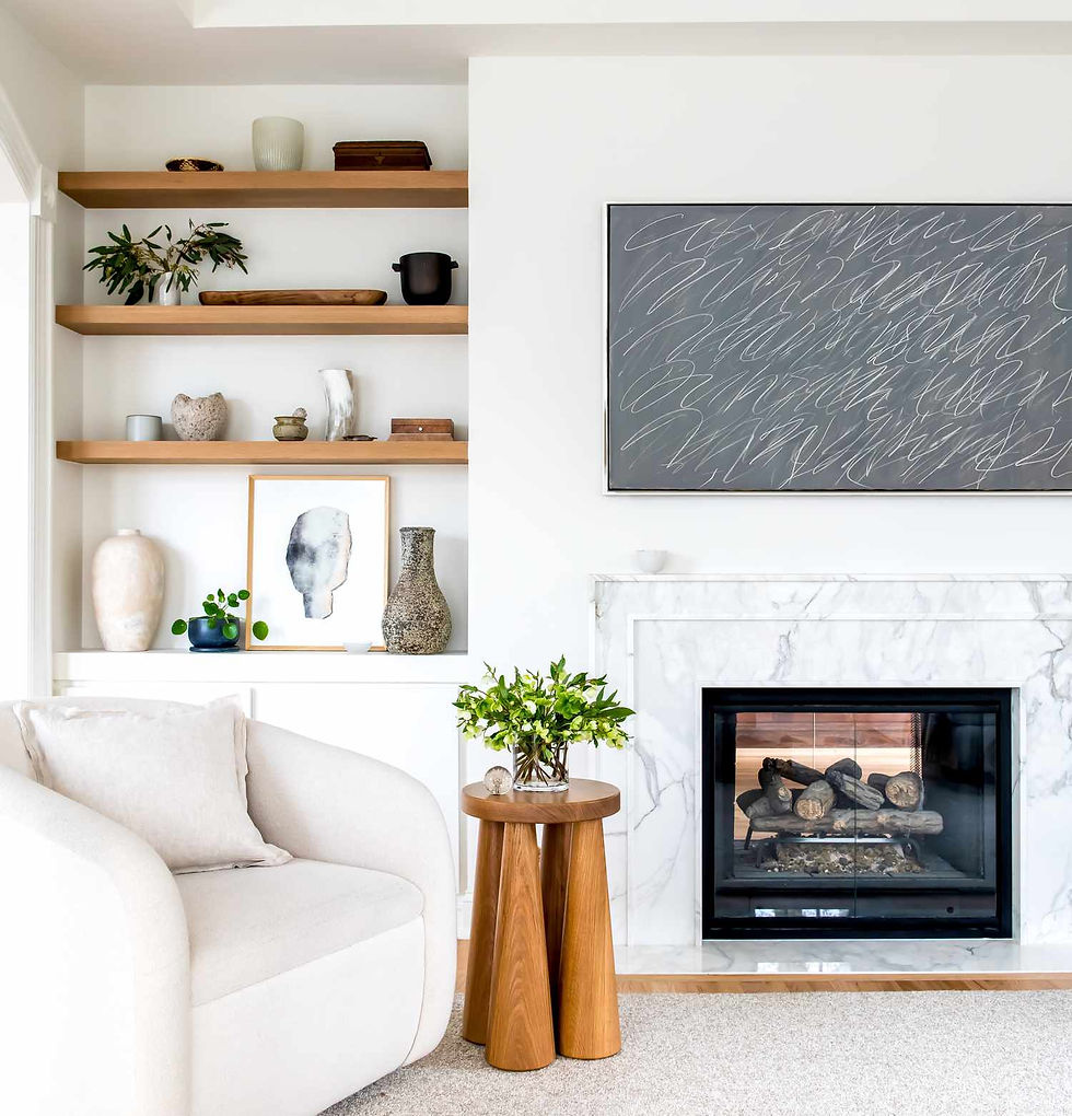 Floating wooden shelf mounted on a white wall, holding books and decorative items.