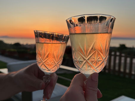 Two glasses of wine at sunset