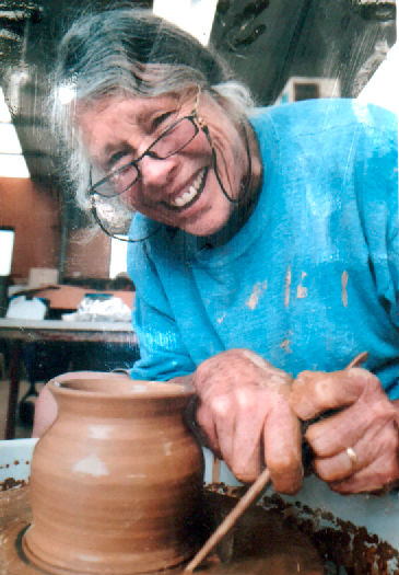 Sue Thorn photo of her at the potters wheel