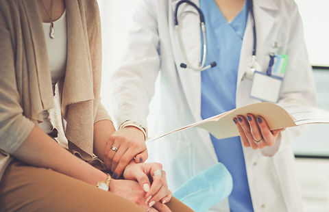 Doctor Holding Patient's Hand_edited.jpg