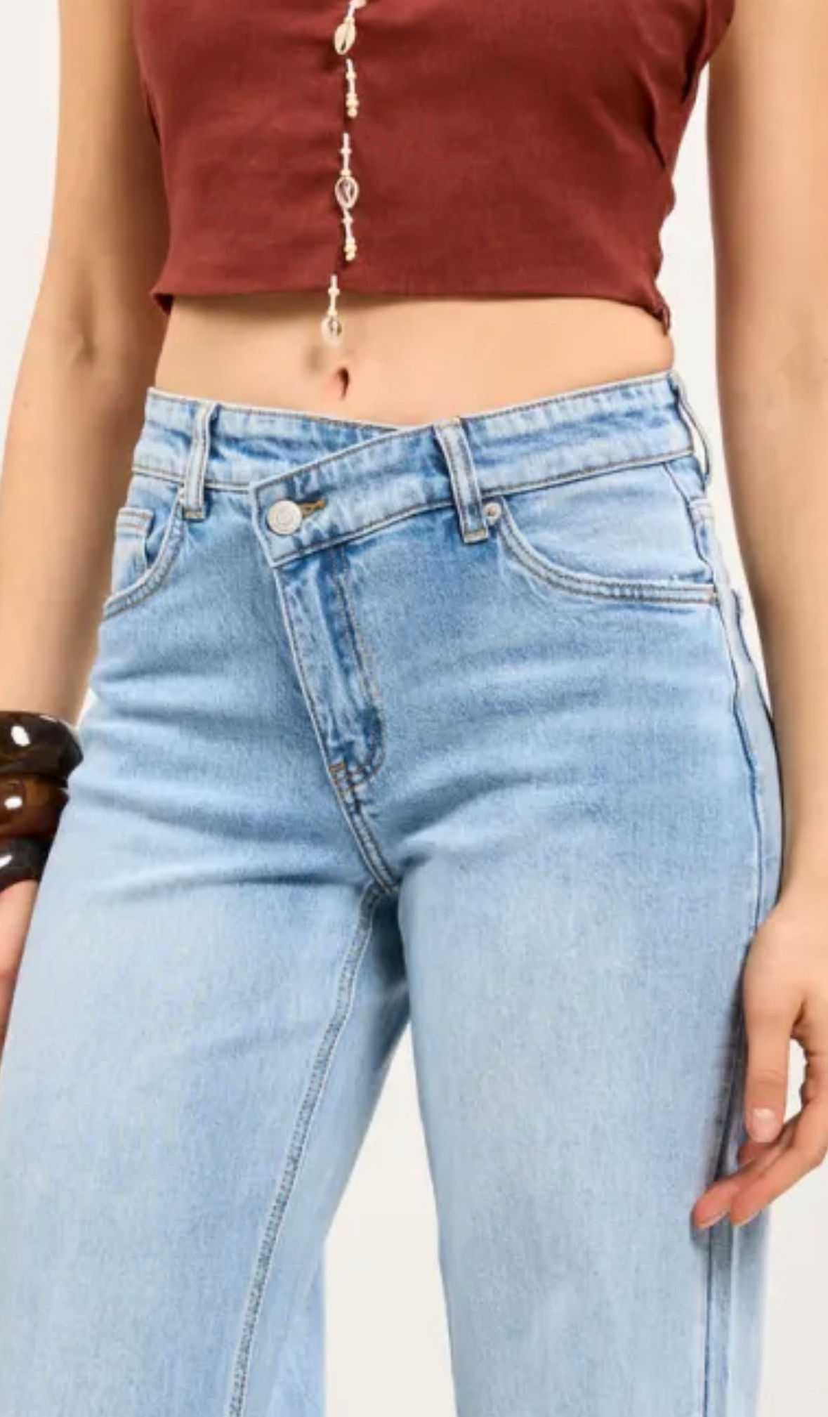 Toxik jeans met asymmetrische knoop- en ritssluiting