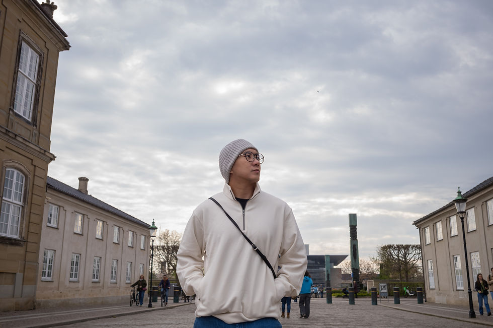 Casual portrait of a man captured by a local photographer while strolling through the charming city streets