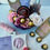 Thumbnail: Red Rose Gift Basket  decorated with silk forever roses and ferrero rocher chocolates