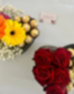 Giftbox with sunflowers and chocolates