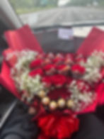 Romantic red rose bouquet with cash , flowers and chocolates