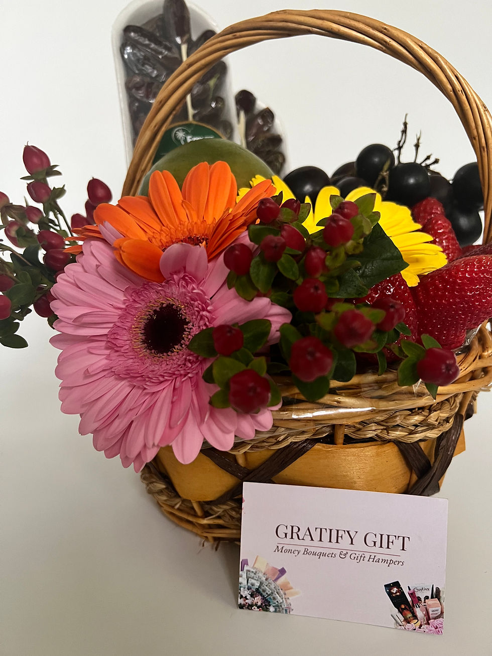 Thumbnail: Indulgent gift hamper featuring fruits and blooms
