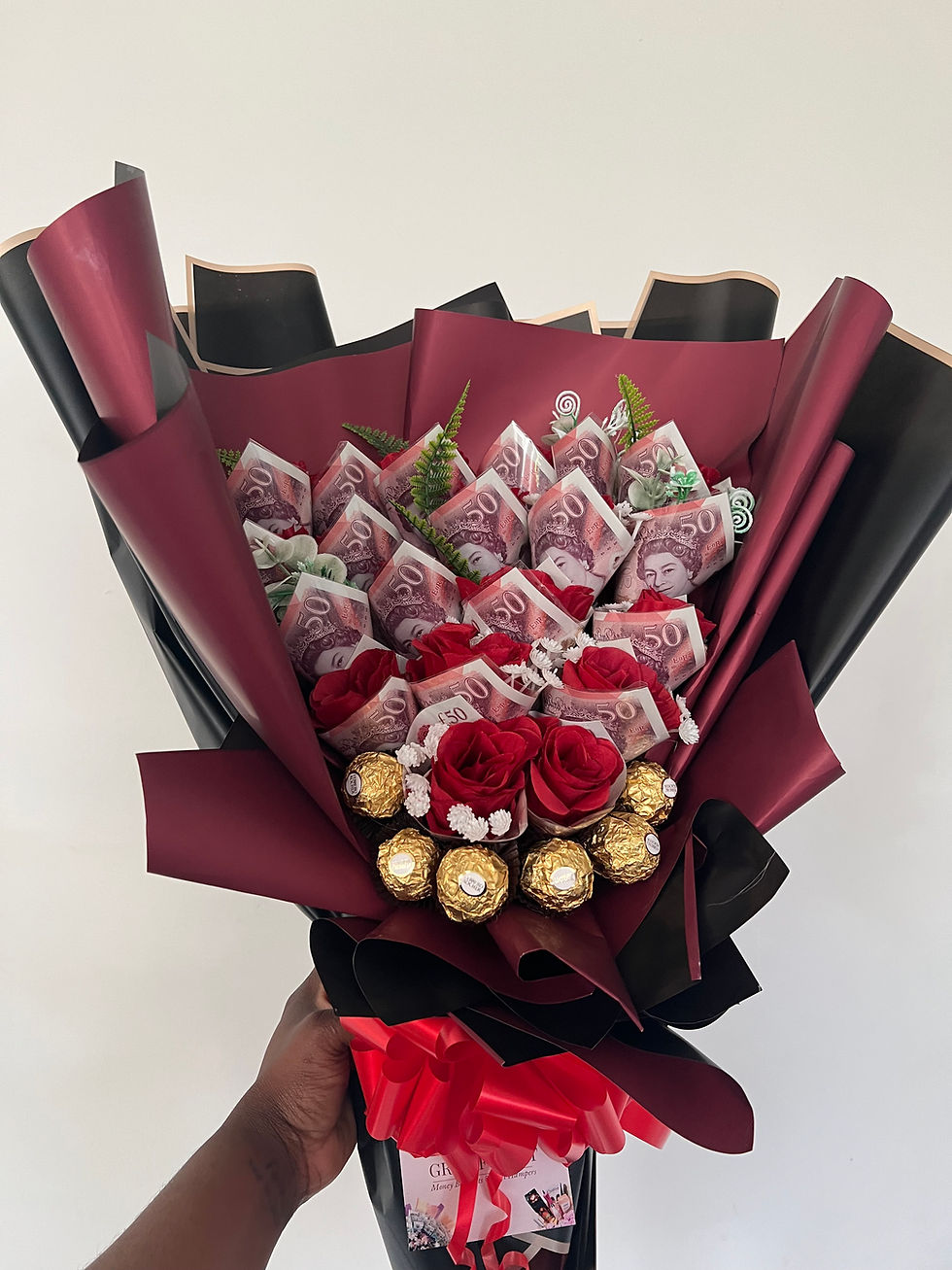 red and black money bouquet