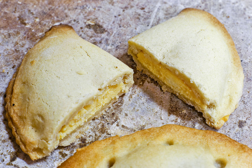 Traditional Mallorcan sweet pastry Rubiols with custard filling