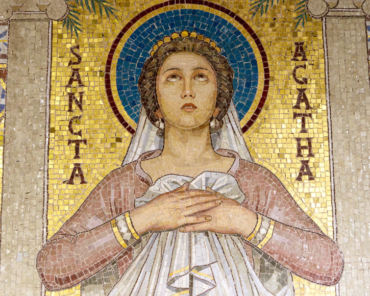 St Agatha depicted in Santa Cecilia church in Rome. The saint that is honoured in the Santa Àgueda Festival in Mallorca. The patron saint of the town of Sencelles. 