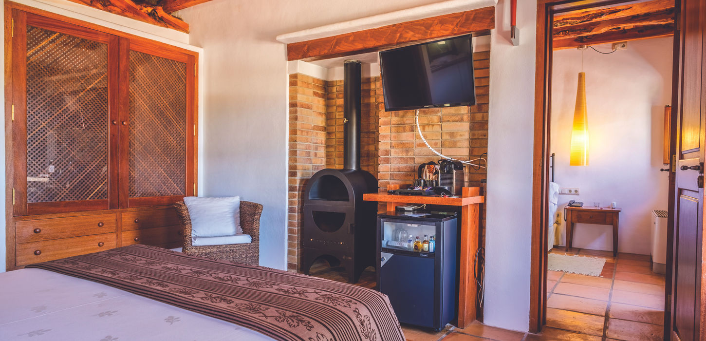 Authentic charm meets modern comforts in one of the beautiful rooms at Can Lluc Agroturismo, Ibiza
