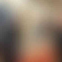 Bodycare business owner talks with customers about her products from behind her stall