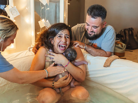 Mother holding newborn after home birth in Phoenix, Arizona