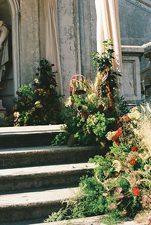 Organic maximalist wedding ceremony floral design with red flowers at Vandelli Botanical Garden Lisbon Portugal by Oh Maria Flores