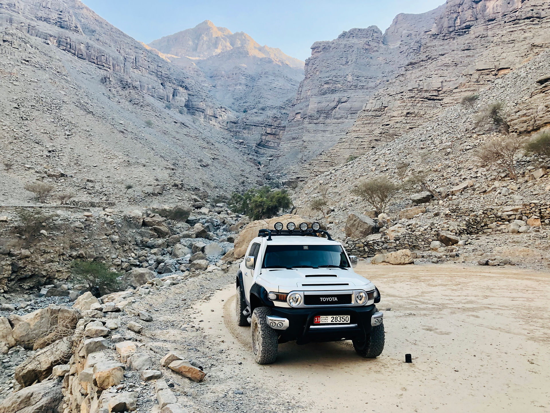 White Jeep Driving in the Ras Al Khaimah Desert