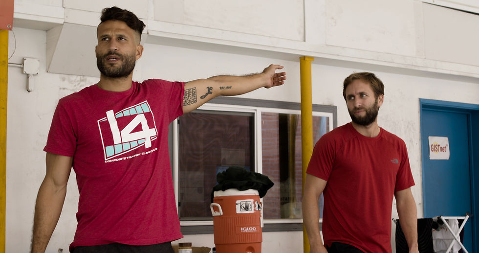 Al Brown and Ediz Basol wear red Gate 14 shirts and speak to their fitness community