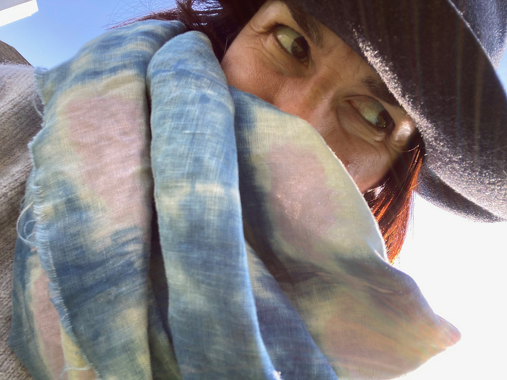 Adriana Ochoa headshot with hand-dyed fabric in foreground