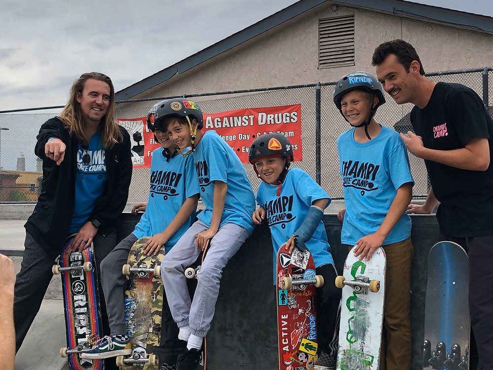 Skating instructors with students
