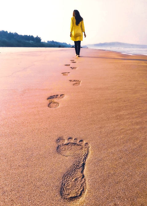 woman on path in beach sand vertical.jpg