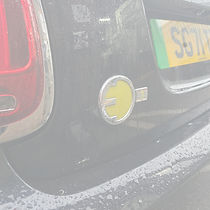 A close up of the EV badge on a Mini Cooper at Torque Monkey garage, Chelmsford