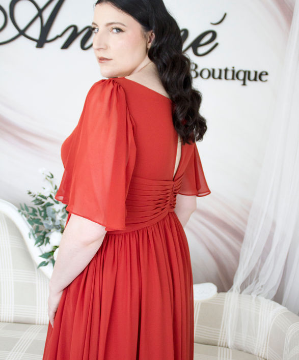 A-line chiffon bridesmaids dress with gathered skirt, pleated bodice, and soft ruffle sleeves – Kenney, available in over 25 colors.