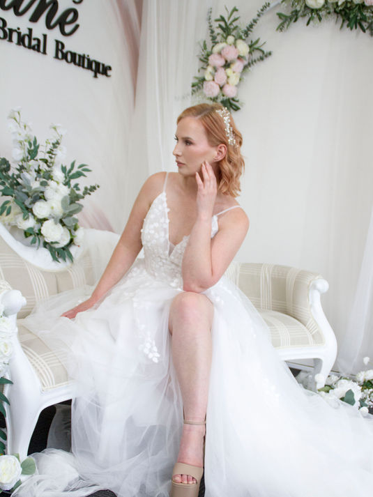 Soft tulle boho wedding dress with leaf-inspired lace, delicate straps, and back button detail – Dahlia bridal gown for a whimsical fairytale look.