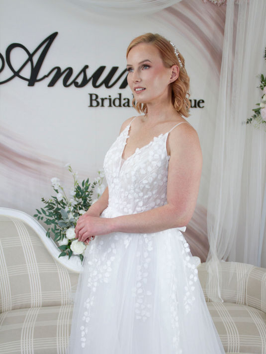 Soft tulle boho wedding dress with leaf-inspired lace, delicate straps, and back button detail – Dahlia bridal gown for a whimsical fairytale look.