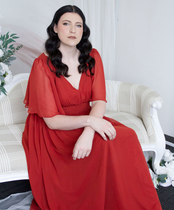 A-line chiffon bridesmaids dress with gathered skirt, pleated bodice, and soft ruffle sleeves – Kenney, available in over 25 colors.