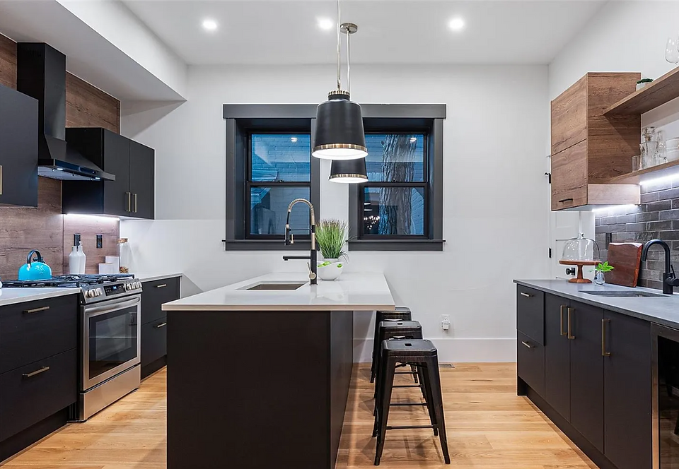 Open sightlines from the kitchen connect seamlessly to dining and living areas, inviting flow and light.