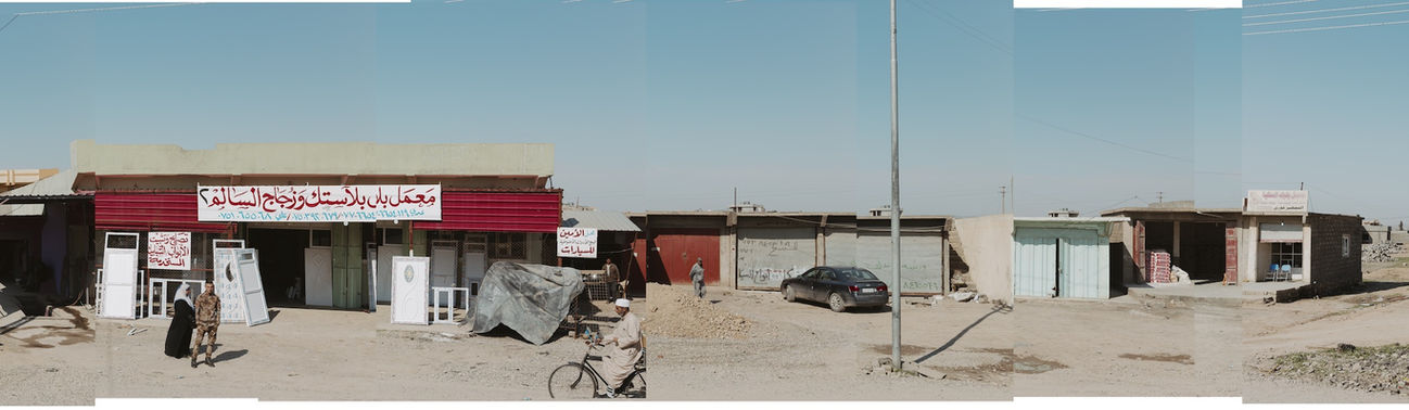 Panoramic image of Iraqi people walking on the street in Iraq