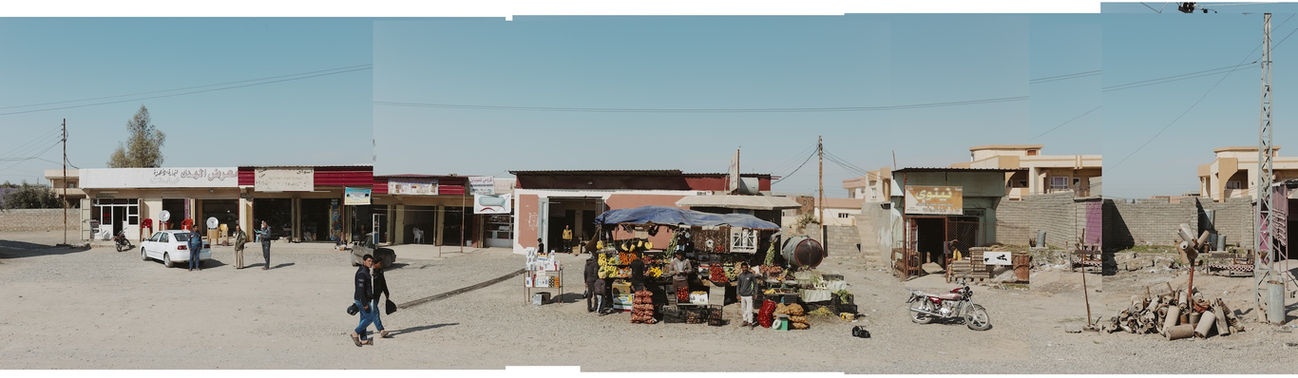 Panoramic image of Iraqi people walking on the street in Iraq