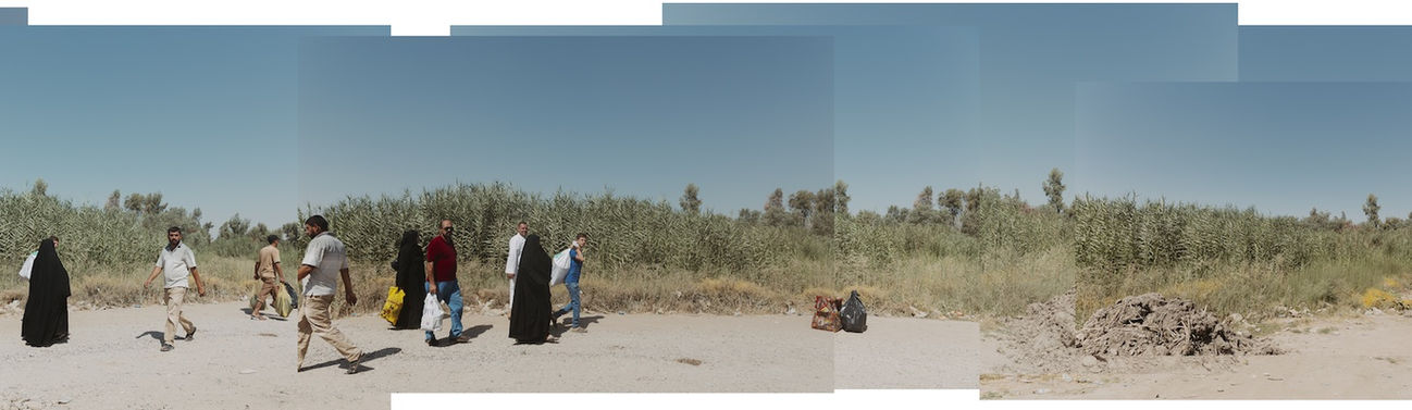 Panoramic image of Iraqi people walking on the street in Iraq