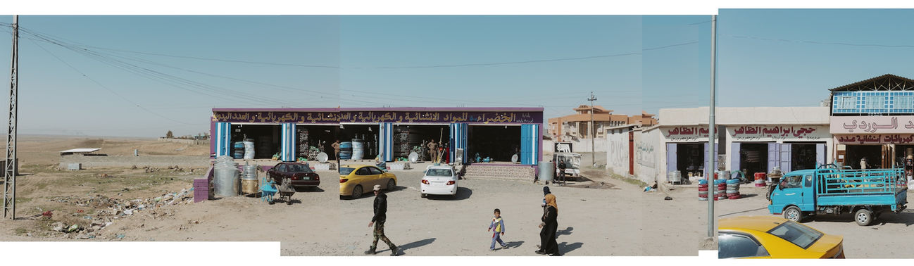 Panoramic image of Iraqi people walking on the street in Iraq