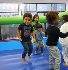 Young kids on a bouncy house for a birthday party at Prospect Gymnastics in Brooklyn