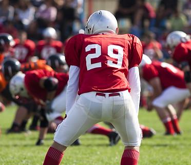 american football game with out of focus players in the background.jpg