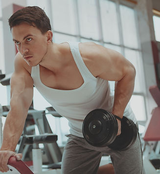 Man working out in need of recovery