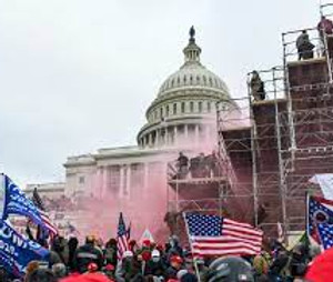Rioters clime scaffolding outside the U.S. Capitol