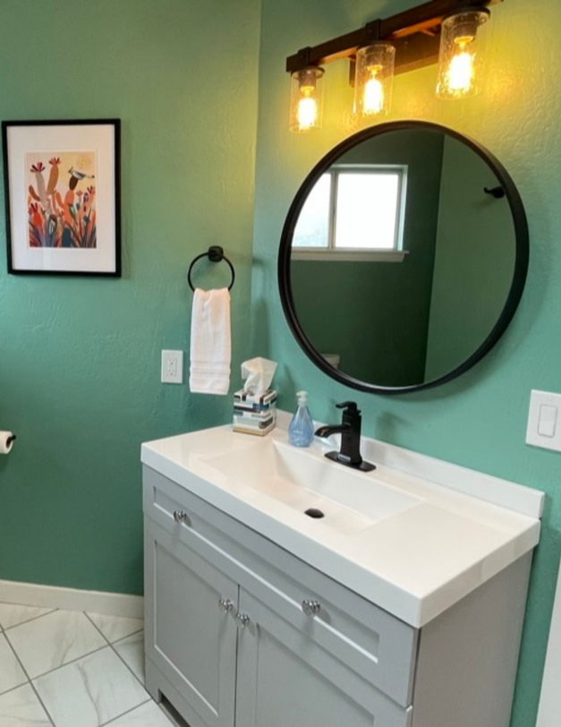 Short-term rental bathroom with clean design and functional touches