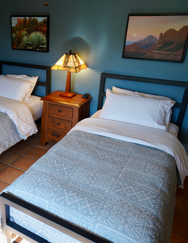 Minimalist Airbnb bedroom design with warm desert tones