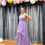 Thumbnail: Lilac plunge shimmer net high low  gown