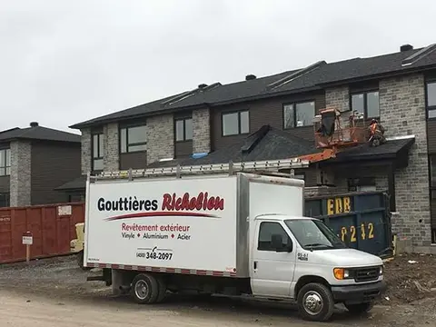 A truck in front of a house