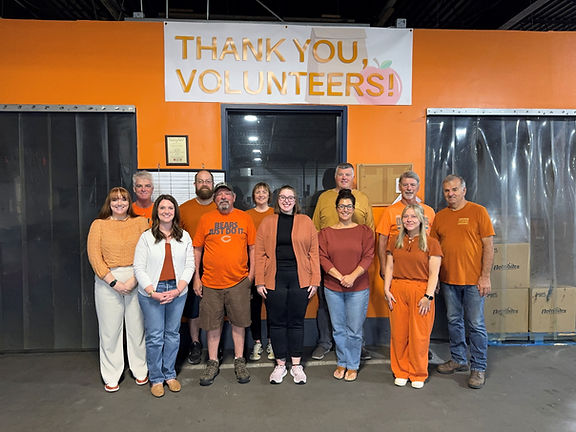 Food Bank of Siouxland staff wearing orange to advocate for Hunger Action Month.