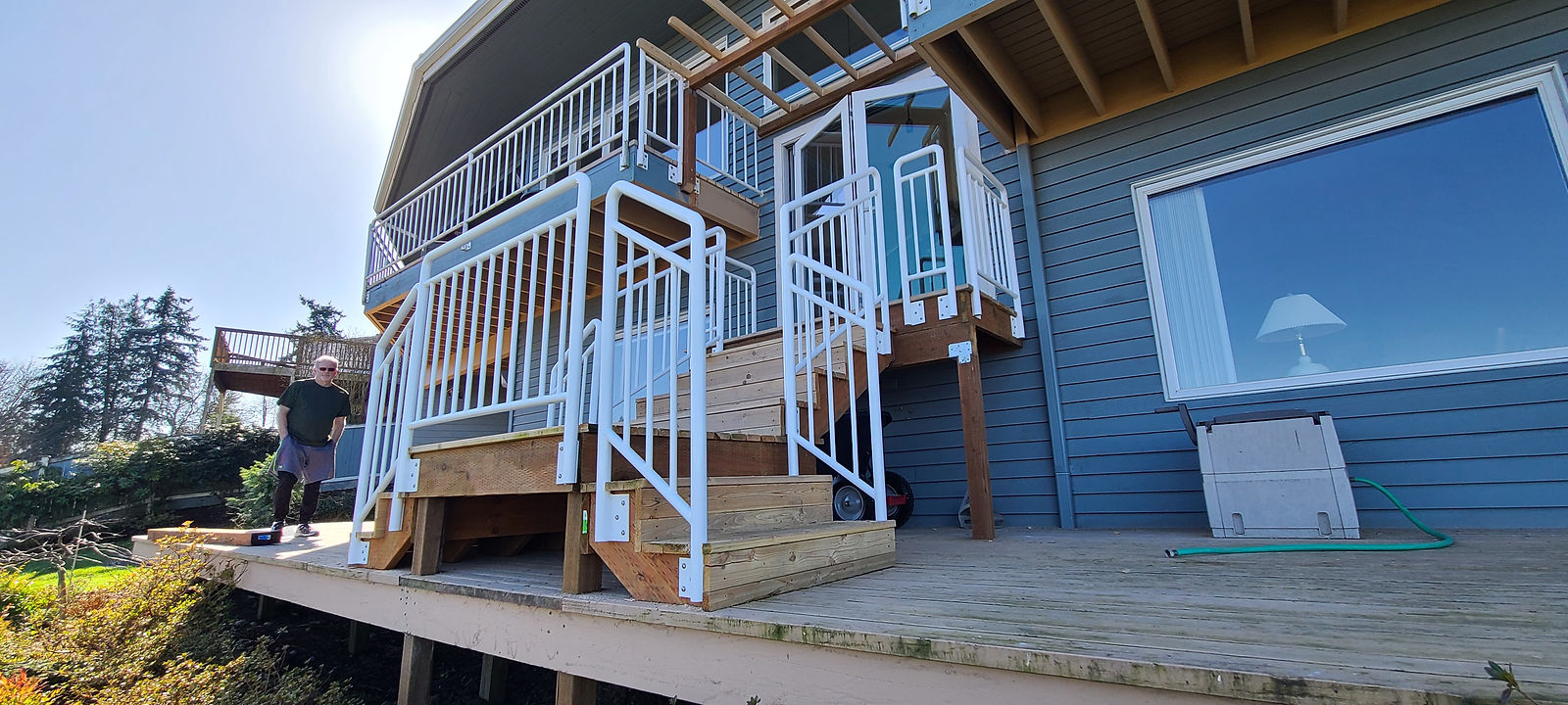 Exterior white steel guard rails with vertical bar infill. — view 4