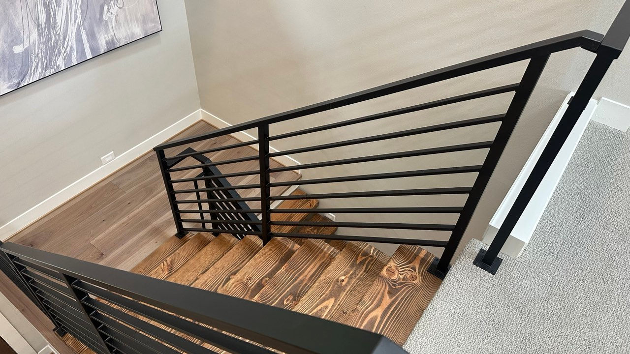 Interior steel guard rails with horizontal bar infill on a loft landing. — view 2