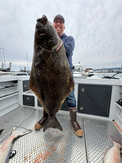 Chris and his 100lb Hailbut